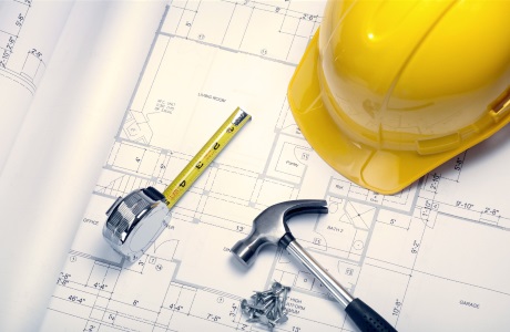 О Группе Компаний НПК «Завод модульного энергооборудования» Стол инженера строителя с чертежом и инструментами